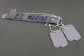 U.S. MARINES Branch Tape with dog tags on olive drab uniform