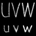 U, v, w handwritten white chalk letters isolated on black background