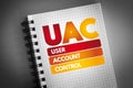 UAC - User Account Control acronym on notepad, technology concept background
