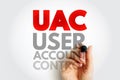 UAC USER ACCOUNT CONTROL written by hand. Conceptual cybersecurity image depicting system authorization, administrative Royalty Free Stock Photo