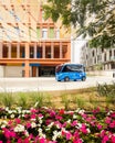 UAE, Abu Dhabi - 13th march, 2023: Autonomous car stand in futuristic city Masdar by Eco-friendly architecture. Masdar future City