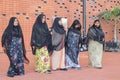 EXPO 2020. Woman mothers perform national dance in traditional mask burqa with moustache shape