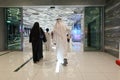 People walk to entrance to Dubai metro station at EXPO 2020. Modern design of underground station Royalty Free Stock Photo