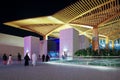 People walk to entrance to Dubai metro station at EXPO 2020. Modern design of underground station Royalty Free Stock Photo
