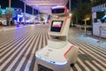 Security robot keeping order at exhibition. Machine ask to wear on face mask in EXPO 2020.