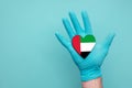 UAE medical health heart. Nurse hand holding country heart flag