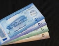 UAE new polymer currency notes of five, ten, fifty and five hundred dirhams on black background Royalty Free Stock Photo