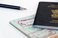 UAE visa stamping procedure, united arab emirates and indian official stamps on a passport page, letters mentioned in arabic and Royalty Free Stock Photo