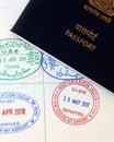 UAE visa stamping, united arab emirates and indian official stamps on a passport page, letters mentioned in arabic and hindi Royalty Free Stock Photo