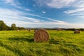 Uautmn rural landscape with meadow, haystack, smaller village and hills on the background Royalty Free Stock Photo