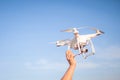 The UAV drone and photographer man hands.drone copter flying with digital camera. UAV Drone with digital camera. Royalty Free Stock Photo