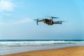 UAV Drone Quadcopter And Digital Camera Flying On Beach Royalty Free Stock Photo