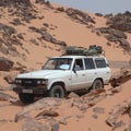 Tourists jeep driving in the Sahara