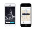 Uber app startup page and Uber search cars map on white and black Apple iPhones Royalty Free Stock Photo