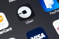 Uber application icon on Apple iPhone X screen close-up. Uber app icon. Uber is taxi car transportation application. Royalty Free Stock Photo