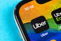 Uber application icon on Apple iPhone X screen close-up. Uber app icon. Uber is taxi car transportation Royalty Free Stock Photo