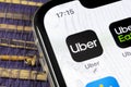 Uber application icon on Apple iPhone X screen close-up. Uber app icon. Uber is taxi car transportation Royalty Free Stock Photo