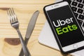 Uber Eats application icon on Apple iPhone smartphone screen close-up. Uber eats app icon. Social network. Social media icon Royalty Free Stock Photo