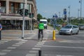 UberEATS cycle delivery courier. Uber Eats delivery in progress on Warsaw street