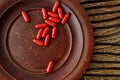 Ubiquinol coQ10 coenzyme q10 supplement softgels on a clay plate. immune prevention care concept Royalty Free Stock Photo