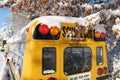 The well-known yellow school bus covered in snow in Vancouver