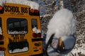 The well-known yellow school bus covered in snow in Vancouver