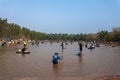 Ubon Ratchathani, Thailand - March 20, 2020 : Many Thai people casting a net for catching fish at river. Fishermen show ancient