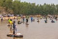 Ubon Ratchathani, Thailand - March 20, 2020 : Many Thai people casting a net for catching fish at river. Fishermen show ancient