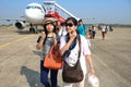 UBONRATCHATHANI THAILAND MARCH 8 2013: Tourists getting off a airasia Air plane on Ubonratchathani Airport, Thailand