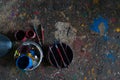 UBUD/BALI-APRIL 27 2019: colorful paint bucket with a brush and the floor is filled with beautiful solid color because the paint