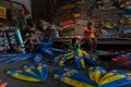 UBUD/BALI-APRIL 27 2019: Two female craftsmen from Ubud were making mini surf boat crafts that were drawn and colored using