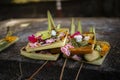 Ceremonial daily offering selective focus on foreground. Ubud. Bali. Indonesia