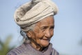 Portrait old poor woman to Bali island. Inhabitants of Bali are kind and friendly even in old age