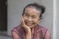 Portrait of a indonesian old woman on a street in the city of Ubud in Bali, Indonesia Royalty Free Stock Photo