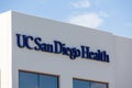 UC San Diego Health sign on hospital building facade. UC San Diego Health is the academic health system of the University of