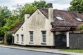 Uccle, Brussels - Belgium , Facade of an Old farmers house and gate in the city on a deserted road