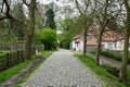 Uccle, Brussels Capital Region, Belgium -Cobblestone road and farmhouse in the Fond\' Roy park