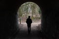 Uccle, Brussels Capital Region, Belgium - Lonely man walking under an arched bridge