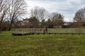 Uccle, Brussels Capital Region, Belgium - Mother and sun walking through the Keyenbempt city nature reserve with green fields