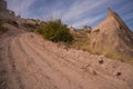 Uchisar, Cappadocia, Turkey: The road leads to the city and Uchisar fortress. Rock houses and churches Royalty Free Stock Photo