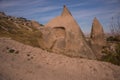 Uchisar, Cappadocia, Turkey: The road leads to the city and Uchisar fortress. Rock houses and churches Royalty Free Stock Photo