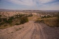 Uchisar, Cappadocia, Turkey: The road leads to the city and Uchisar fortress. Rock houses and churches Royalty Free Stock Photo