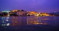 Udaipur City Palace on Pichola lake - Rajput architecture of Mewar dynasty rulers of Rajasthan. Sunset at Udaipur, India