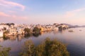 Udaipur cityscape with colorful sky at sunset. The majestic city palace on Lake Pichola, travel destination in Rajasthan, India Royalty Free Stock Photo