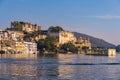 Udaipur cityscape with colorful sky at sunset. The majestic city palace on Lake Pichola, travel destination in Rajasthan, India Royalty Free Stock Photo