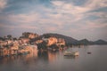 Udaipur cityscape with colorful sky at sunset. The majestic city palace on Lake Pichola, travel destination in Rajasthan, India. T Royalty Free Stock Photo