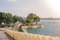 UDAIPUR, INDIA - 10 FEB, 2014 - View of the embankment at Pichola lake in Udaipur Royalty Free Stock Photo