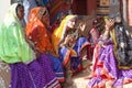 Indian Rajasthani women in traditional clothes selling beads at local market, Rajasthan state