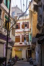 Udaipur, India - January 29, 2017: Walking in the enchanting narrow alleys and streets at Udaipur, famous travel destination in Ra