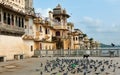 Udaipur / India - 08.11.2019: Pigeons at old building in the colors of Udaipur